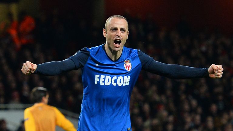Dimitar Berbatov celebrates scoring his team's second goal during the UEFA Champions League round of 16 first leg football match between Arsenal and Monaco