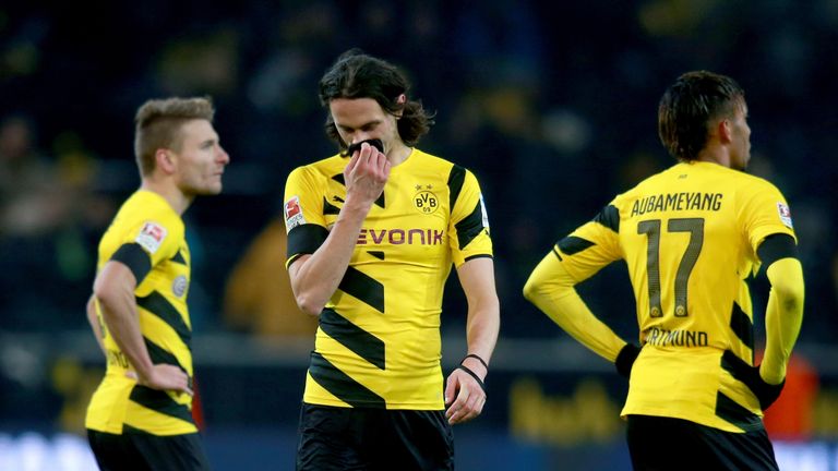 Dortmund's Ciro Immobile (L), Neven Subotic (C) and Pierre-Emerick Aubameyang show their disappointment after the loss to Augsburg