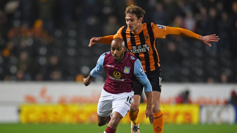 Fabian Delph of Aston Villa goes past Nikica Jelevic of Hull City 