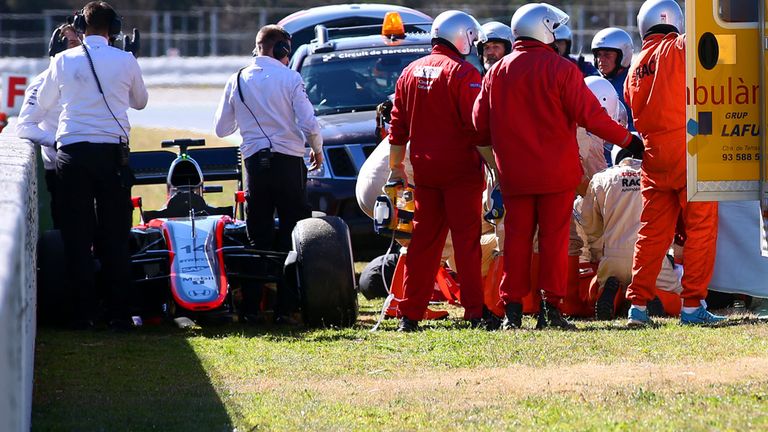 MONTMELO, SPAIN - FEBRUARY 22:  Fernando Alonso of Spain and McLaren Honda receives medical assistance after crashing during day four of Formula One Winter