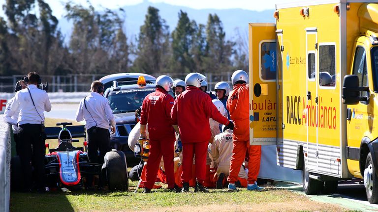 MONTMELO, SPAIN - FEBRUARY 22:  Fernando Alonso of Spain and McLaren Honda receives medical assistance after crashing during day four of Formula One Winter