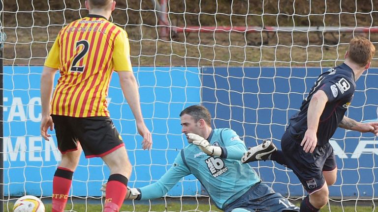 Craig Curran (right) fires Ross County ahead against Partick Thistle at Firhill