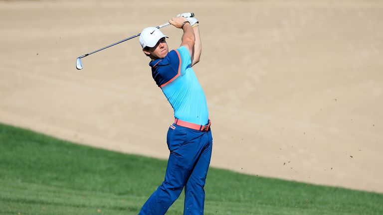 Rory McIlroy of Northern Ireland plays his second shot on the par 4, 14th hole during the final round of the Dubai Desert Classic.