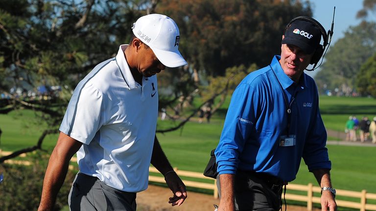 Tiger Woods walks off the course after withdrawing from the Farmers Insurance Open at Torrey Pines