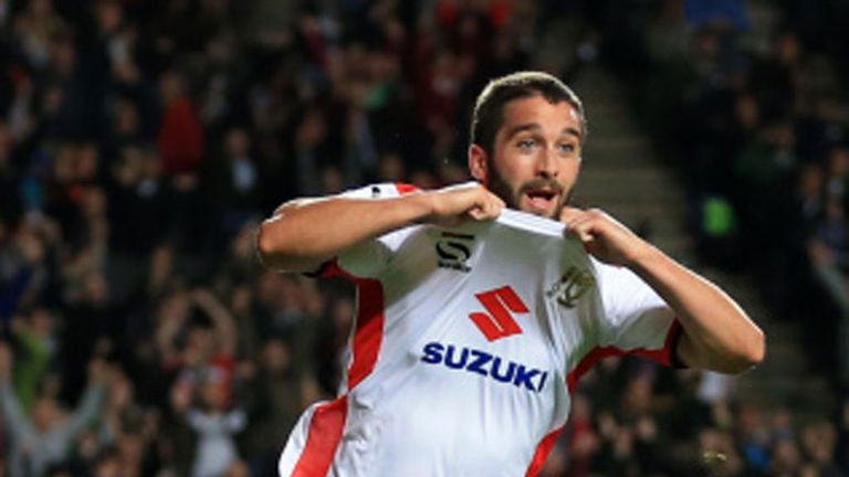 Will Grigg scored the first of MK Dons' three goals