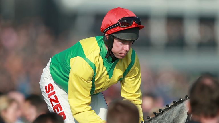 Smashing ridden by Andrew Lynch makes his way to the start of the Coral Cup on Ladies Day, during the Cheltenham Festival.