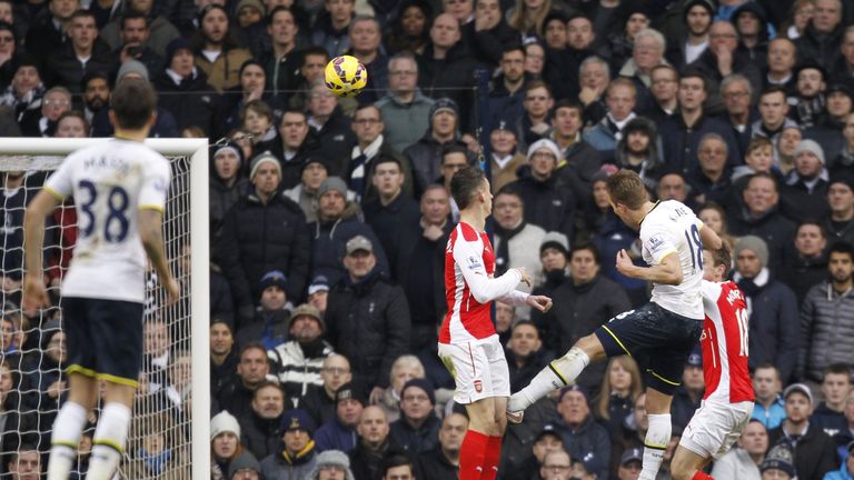 Harry Kane leaps to score Tottenham's winning goal, and his second of the game, with an unstoppable header past Arsenal goalkeeper David Ospina