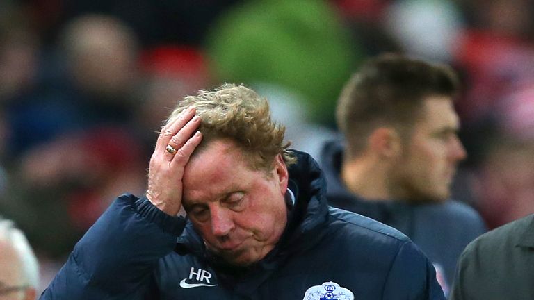 QPR manager Harry Redknapp leaves the field after defeat during the Barclays Premier League match at Stoke