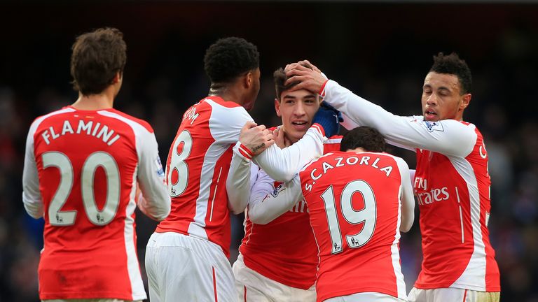Arsenal's Hector Bellerin (centre) celebrates scoring his side's fifth goal during the Barclays Premier League match v Aston Villa, London