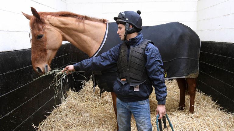 Annie Power is fed by Qasim Raza  as she faces the cameras