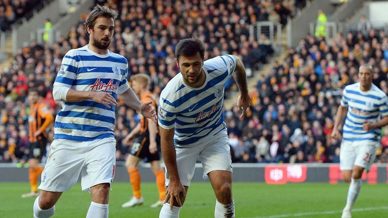 Charlie Austin of QPR feigns injury as part of his celebration after scoring against Hull