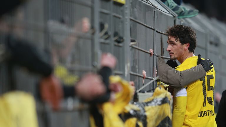 Mats Hummels of Dortmund talks to their supporters after defeat to Augsburg