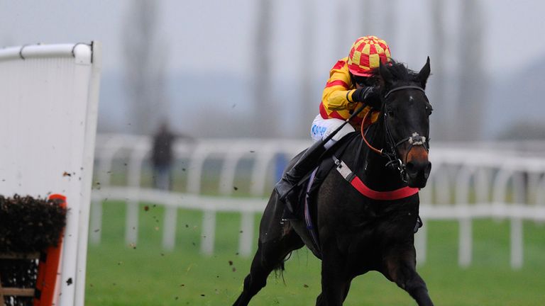 Timmy Murphy riding Ifandbutwhynot clear the last to win The bet365 Intermediate Hurdle Race at Newbury racecourse
