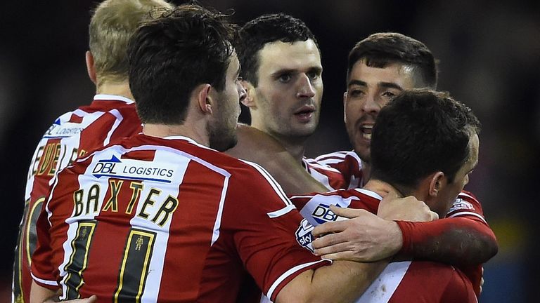 Jamie Murphy of Sheffield United is congratulated