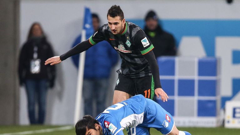 Jin-Su Kim of Hoffenheim falls to the ground