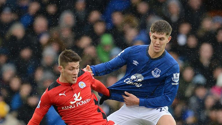 Leicester City's Andrej Kramaric (L) is challenged by Everton's John Stones