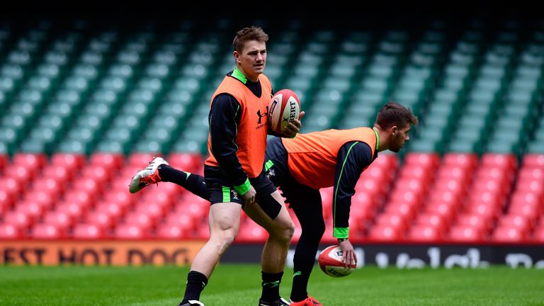 Jonathan Davies (l) and Rhys Webb warm up during Wales training ahead of Friday's opening Six Nations match against England