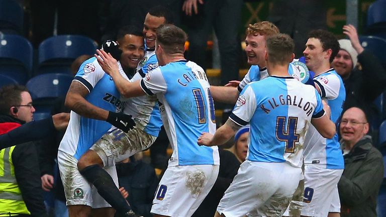 Joshua King of Blackburn is mobbed by team mates after scoring the fourth goal and completing his hat trick against Stoke