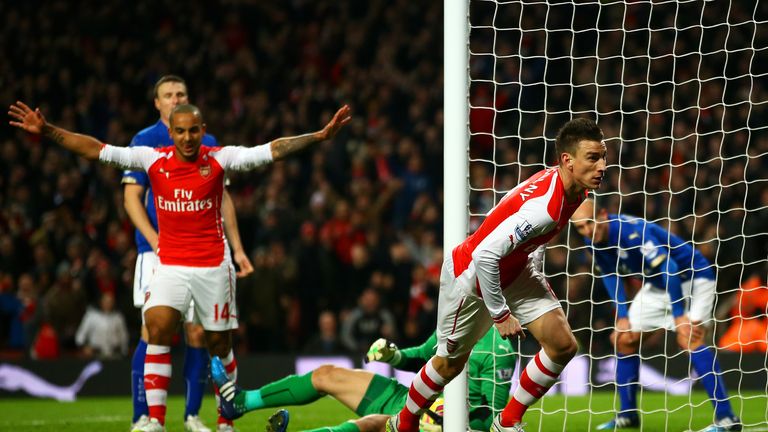 Laurent Koscielny of Arsenal celebrates next to Theo Walcott