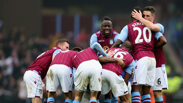 Leandro Bacuna of Aston Villa is mobbed by team mates 