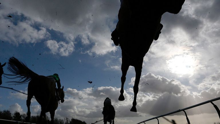 A general view as runners clear the water jump in the Squire Osbaldeston Handicap Chase at Leicester