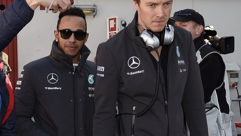 Lewis Hamilton returns to the Barcelona paddock after suffering a fever on the first day of the test