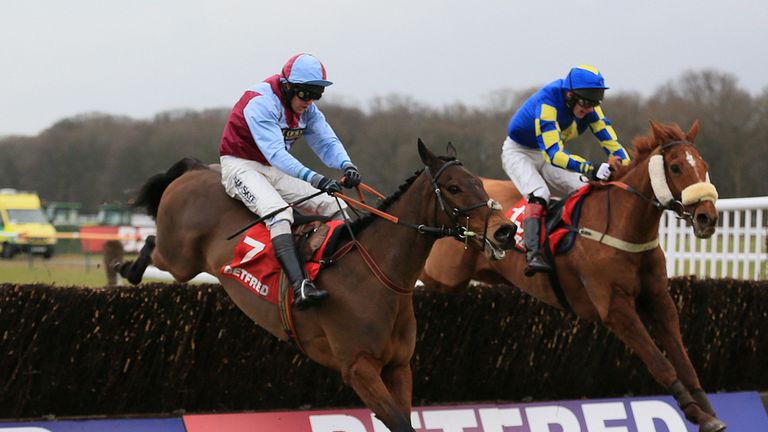 Lie Forrit (near side), ridden by Peter Buchana,n jumps the last fence to win The Betfred Grand National Trial from Harry The Viking.