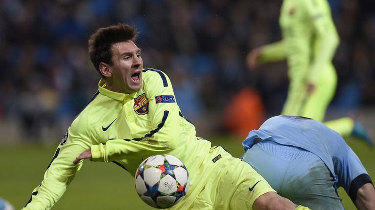 Manchester City defender Pablo Zabaleta brings down Barcelona forward Lionel Messi in the area to concede a penalty during the UEFA Champions League