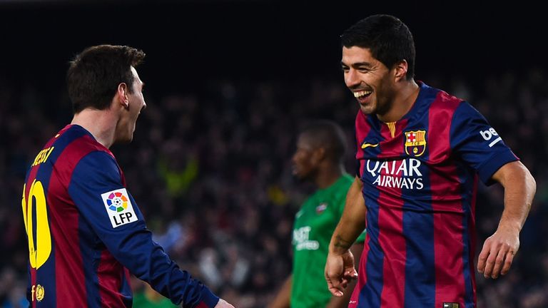 Lionel Messi and Luis Suarez celebrate
