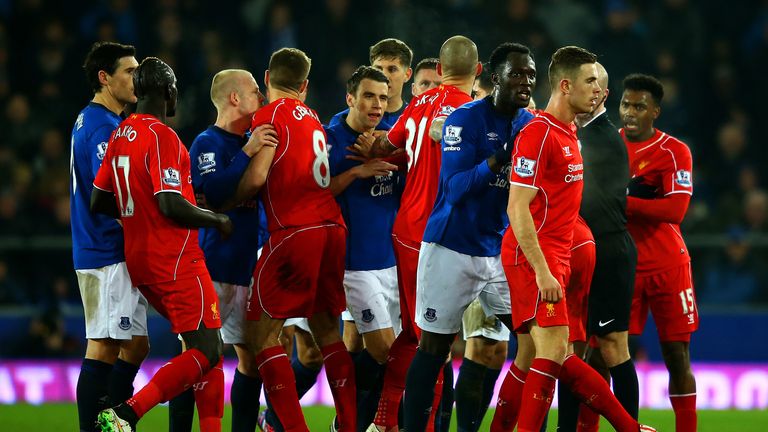 LIVERPOOL, ENGLAND - FEBRUARY 07:  Liverpool and Everton players clash during the Barclays Premier League match between Everton and Liverpool 