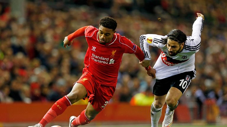 LIVERPOOL, ENGLAND - FEBRUARY 19:  Jordon Ibe of Liverpool goes past Olcay Sahan of Besiktas during the UEFA Europa League Round of 32 match between Liverp