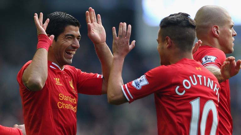 Luis Suarez of Liverpool celebrates scoring his team's second goal with team-mate Coutinho