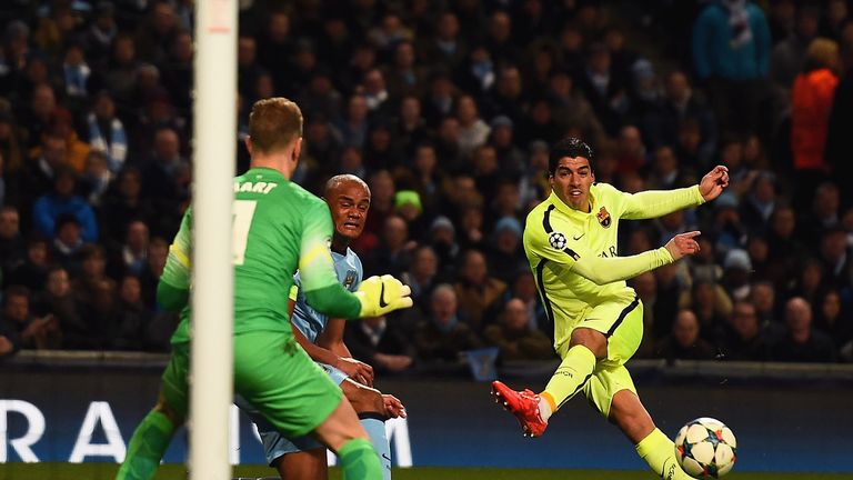Luis Suarez scores the opening goal past Joe Hart during the UEFA Champions League Round of 16 match between Manchester City and Barcelona