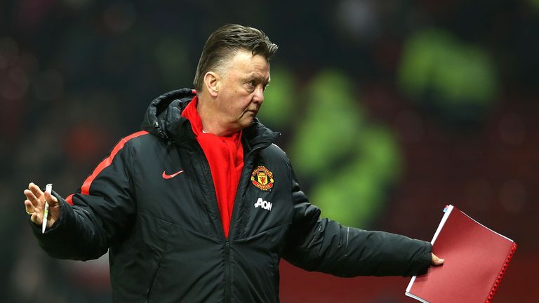 Manchester United boss Louis van Gaal holds another 'dossier' as he heads for the tunnel after his team secured three points in a 3-1 victory over Burnley