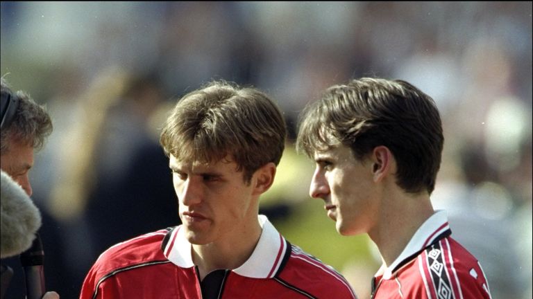 22 May 1999:  The two brothers Gary and Phil Neville of Manchester United celebrate with the trophy after the AXA FA Cup Final match against Newcastle Unit