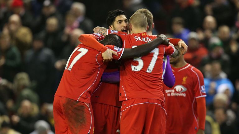 Liverpool's Emre Can and Mario Balotelli celebrates with his team-mates after the Barclays Premier League match at Anfield, Liverpool