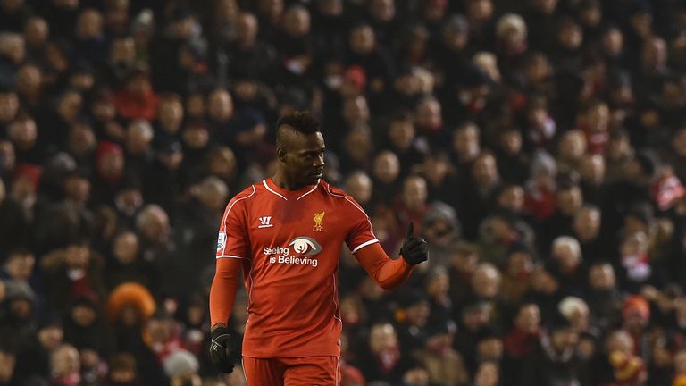 Liverpool's Italian striker Mario Balotelli gives a thumbs up after scoring Liverpool's third goal during the match between Liverpool and Tottenham Hotspur