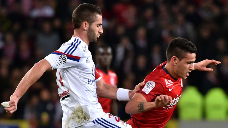 Lyon's French midfielder Maxime Gonalons (L) vies for the ball with Lille's Portuguese midfielder Marco Lopes (R) 