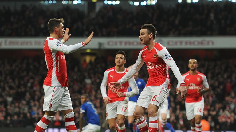 Laurent Koscielny celebrates scoring the 1st Arsenal goal with (L) Mesut Ozil during the Premier League clash with Leicester