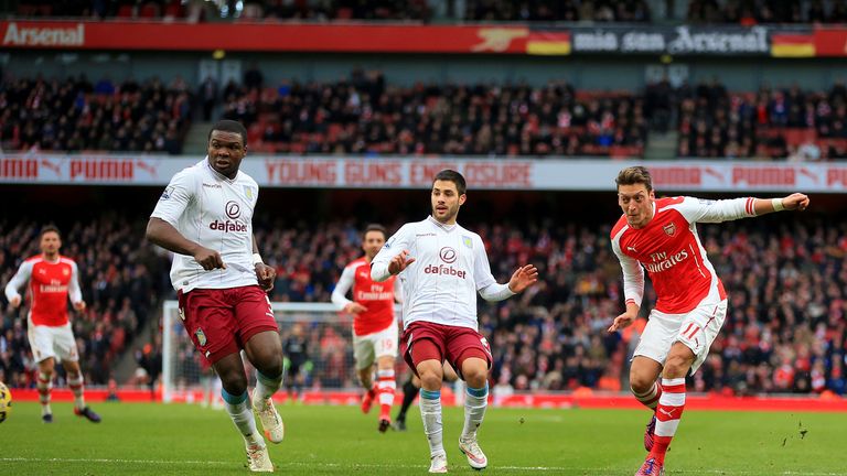 Arsenal's Mesut Ozil scores his side's second goal during the Barclays Premier League match v Aston Villa at Stamford Bridge, London
