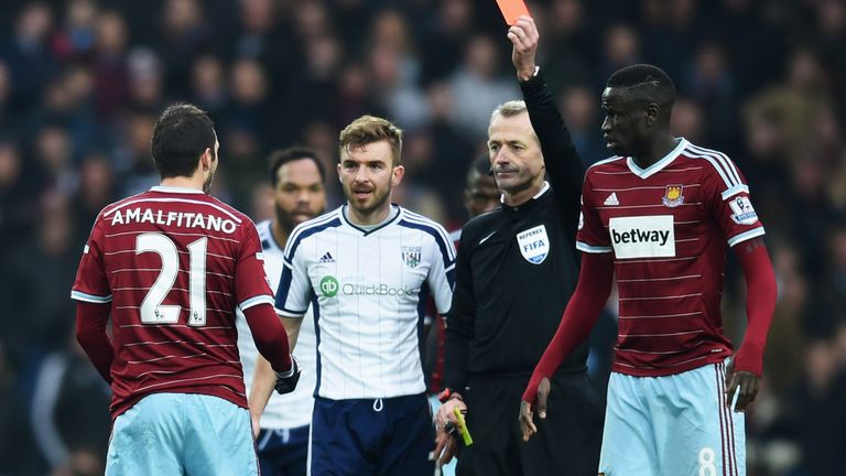 WEST BROMWICH, ENGLAND - FEBRUARY 14:  Morgan Amalfitano of West Ham United is shown a red card by referee Martin Atkinson and is sent off during the FA Cu