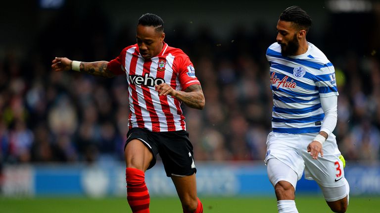 Nathaniel Clyne of Southampton runs with the ball under pressure from QPR's Armand Traore 
