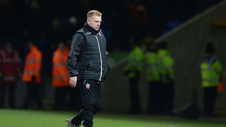 Bolton's manager Neil Lennon leaves the pitch after his team lost 1-2 during the FA Cup fourth round replay football match between Bolton and Liverpool 