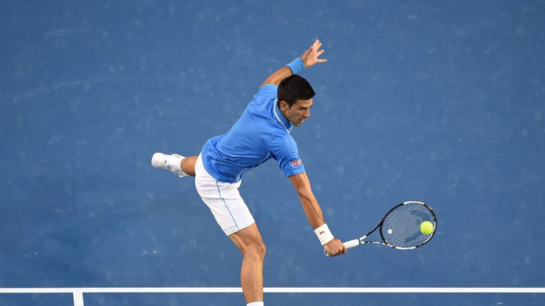 Serbia's Novak Djokovic plays a shot during his men's singles final match against Britain's Andy Murray on day fourteen of the 2015 Australian Open