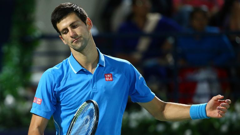 World number one Novak Djokovic of Serbia reacts after losing a point to Roger Federer of Switzerland 