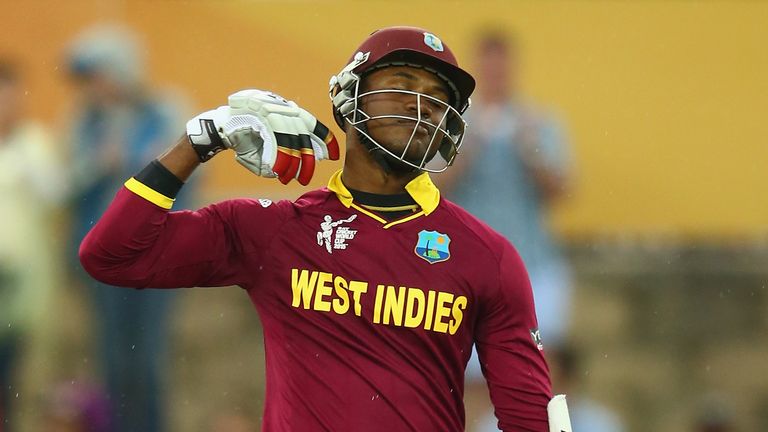 CANBERRA, AUSTRALIA - FEBRUARY 24:  Marlon Samuels of West Indies celebrates his century during the 2015 ICC Cricket World Cup match between the West Indie