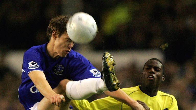 Per Kroldrup of Everton is challenged by Marvin Williams of Millwall during the FA Cup Third Round Replay match 