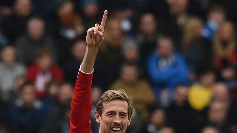 Stoke City's striker Peter Crouch celebrates scoring the opening goal of the FA Cup fifth round football match between Blackburn Rovers and Stoke City