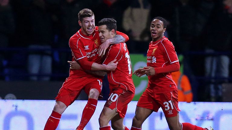 Liverpool's Philippe Coutinho celebrates with Alberto Moreno and Raheem Sterling