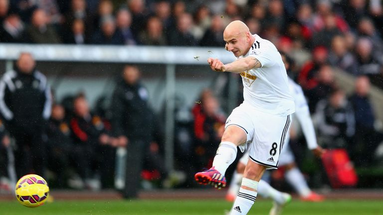 Jonjo Shelvey strikes a  30-yard shot goalbound, which Bafétimbi Gomis deflects into the back of the net - it's 2-1 to Swansea